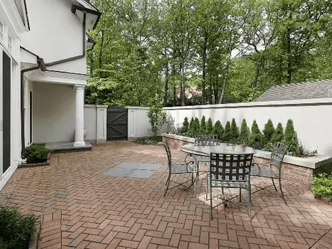 Custom backyard landscape design with new lawn and flower beds in Lucan.