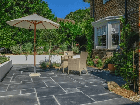 Front garden makeover with lawn edging, shrubs, and low-maintenance design.
